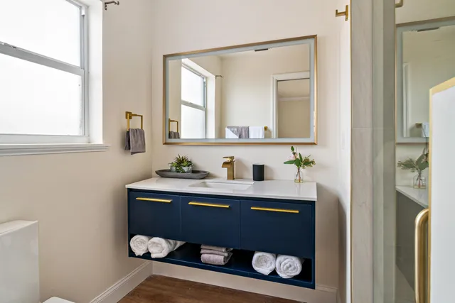 a dining room with furniture and glass door