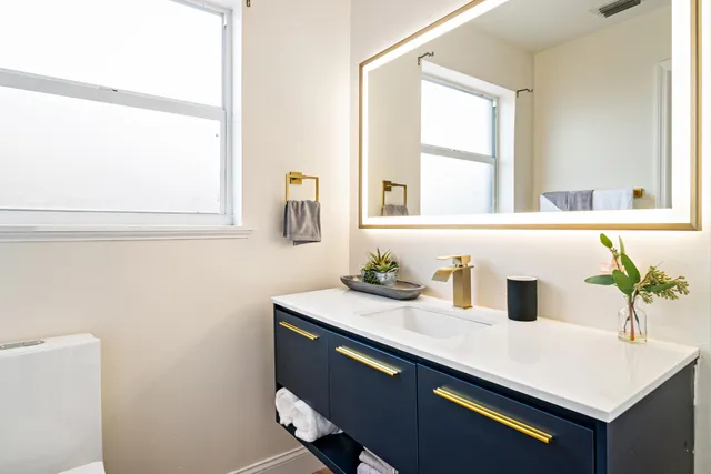 a view of a patio with couches under an umbrella