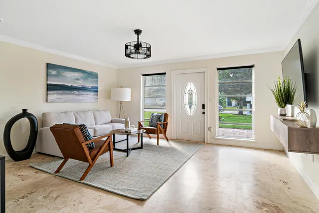 a dining room with furniture and window