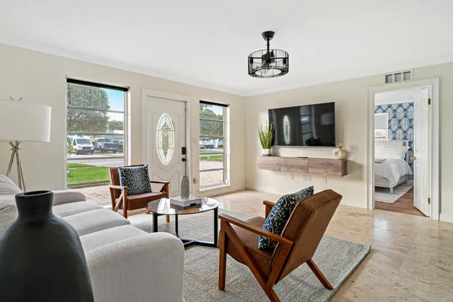 a dining room with furniture and wooden floor