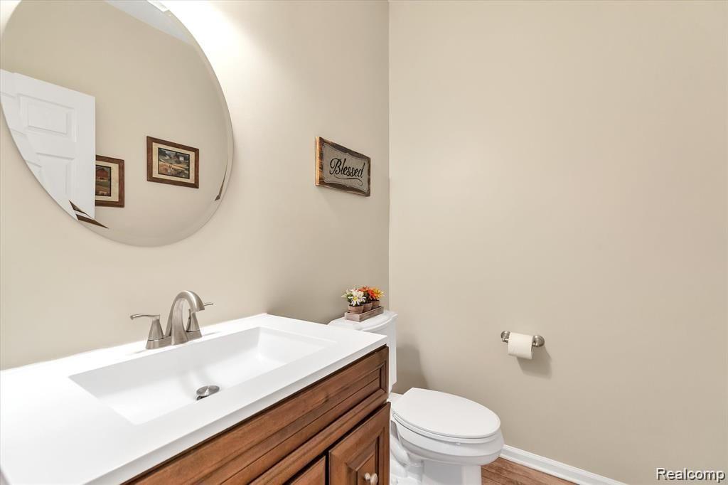 201 Timber Ridge Drive Highland, MI 48357 - Photo 18 of 39 Main floor half bathroom