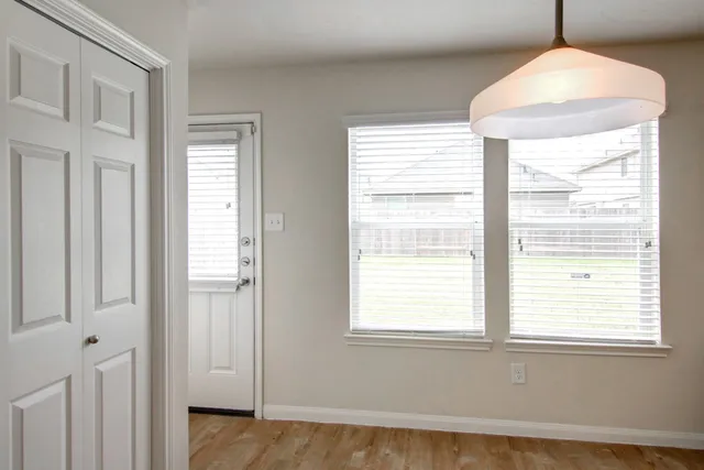 a view of an empty room with a window