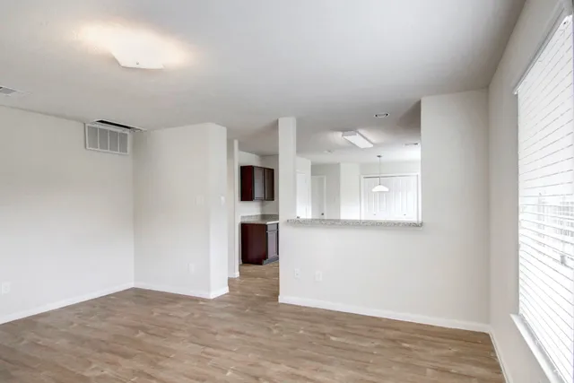 a view of a kitchen with a sink and a window