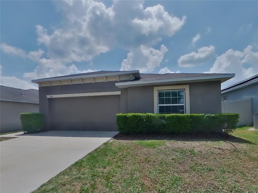209 Archcliffe Point Place Dover, FL 33527 - Photo 1 of 1 a front view of a house with a yard and garage