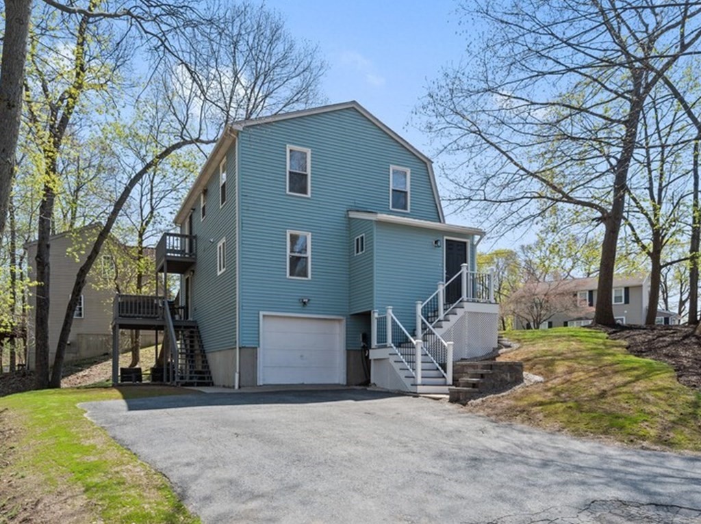 2 Stringer Dam Road Shrewsbury, MA 01545 - Photo 3 of 35 a view of a house with backyard and a tree
