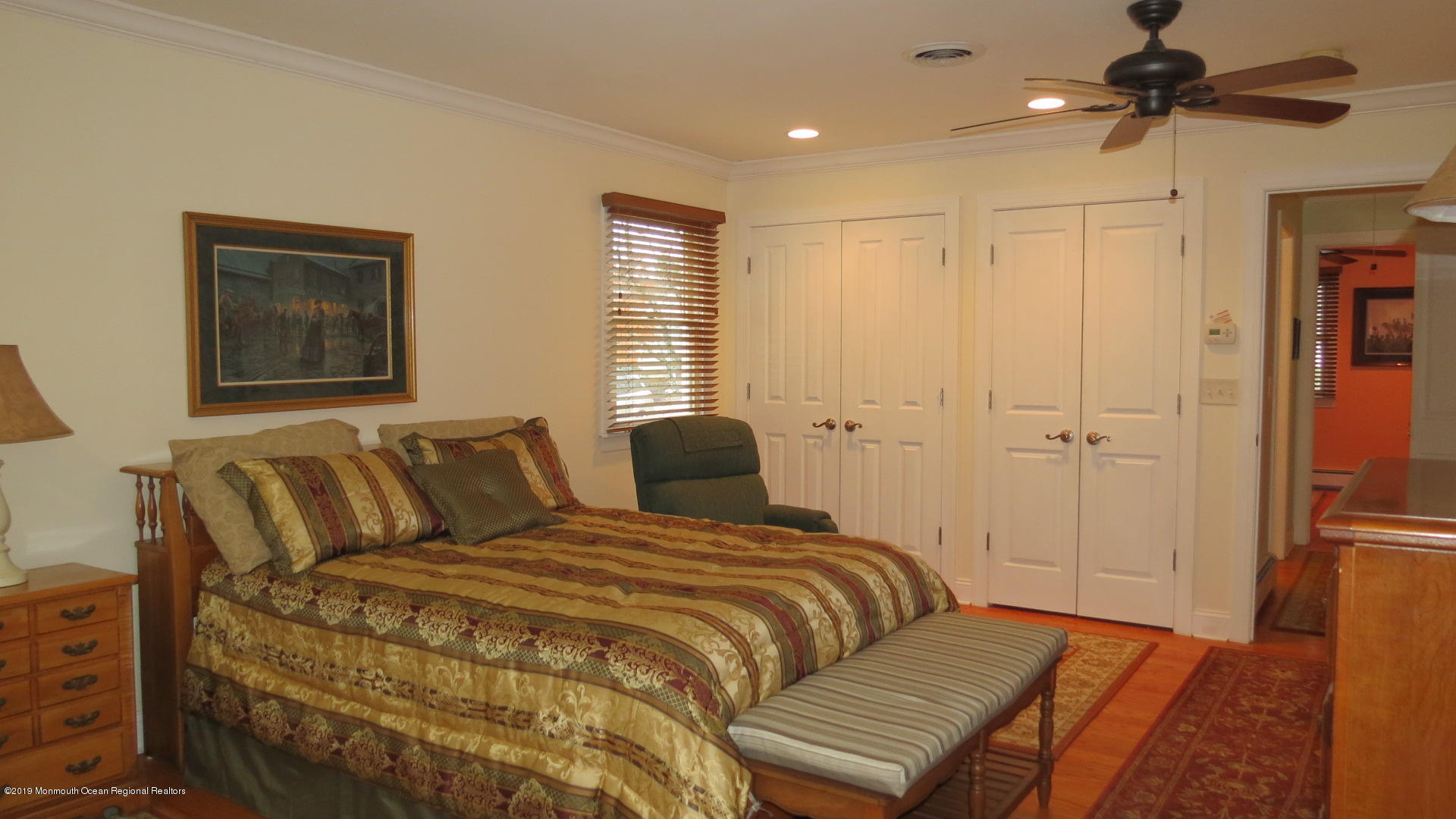 24 Coventry Road Toms River, NJ 08757 - Photo 11 of 21 a bedroom with a bed ceiling fan and a window