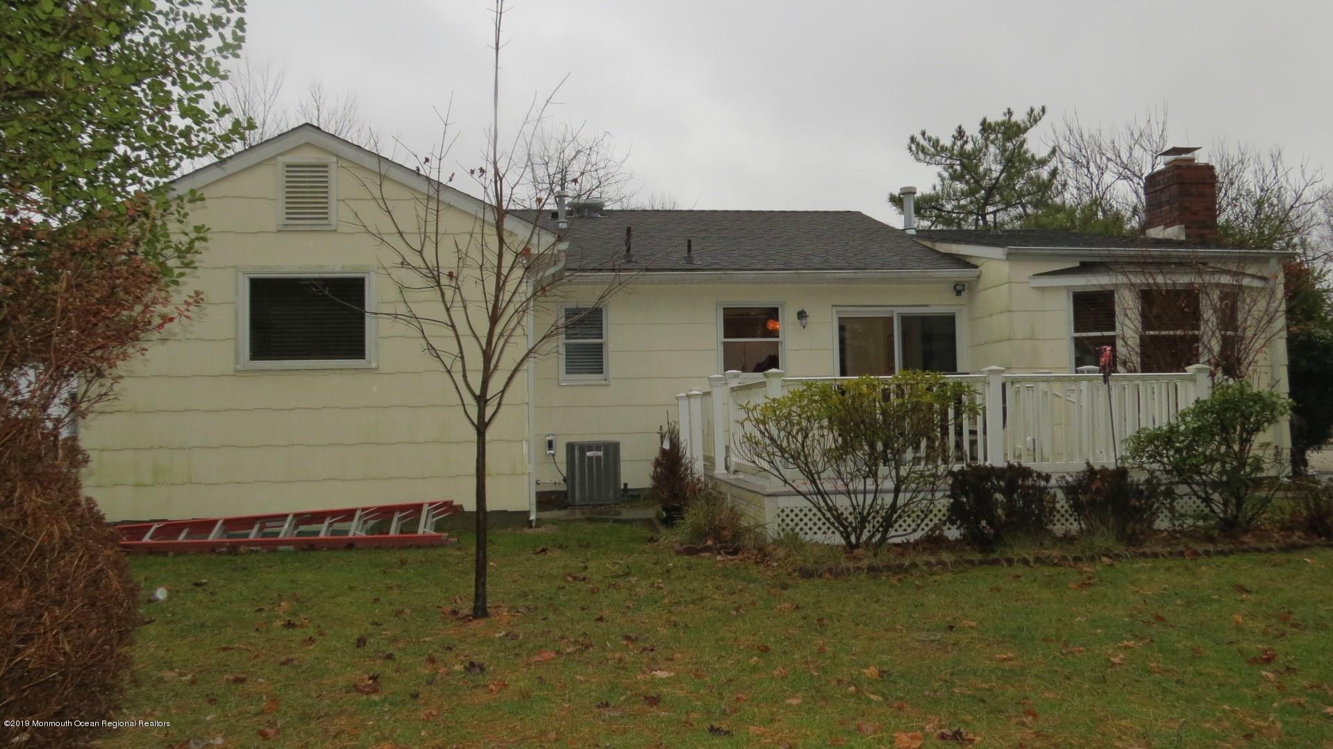 24 Coventry Road Toms River, NJ 08757 - Photo 18 of 21 a front view of a house with garden