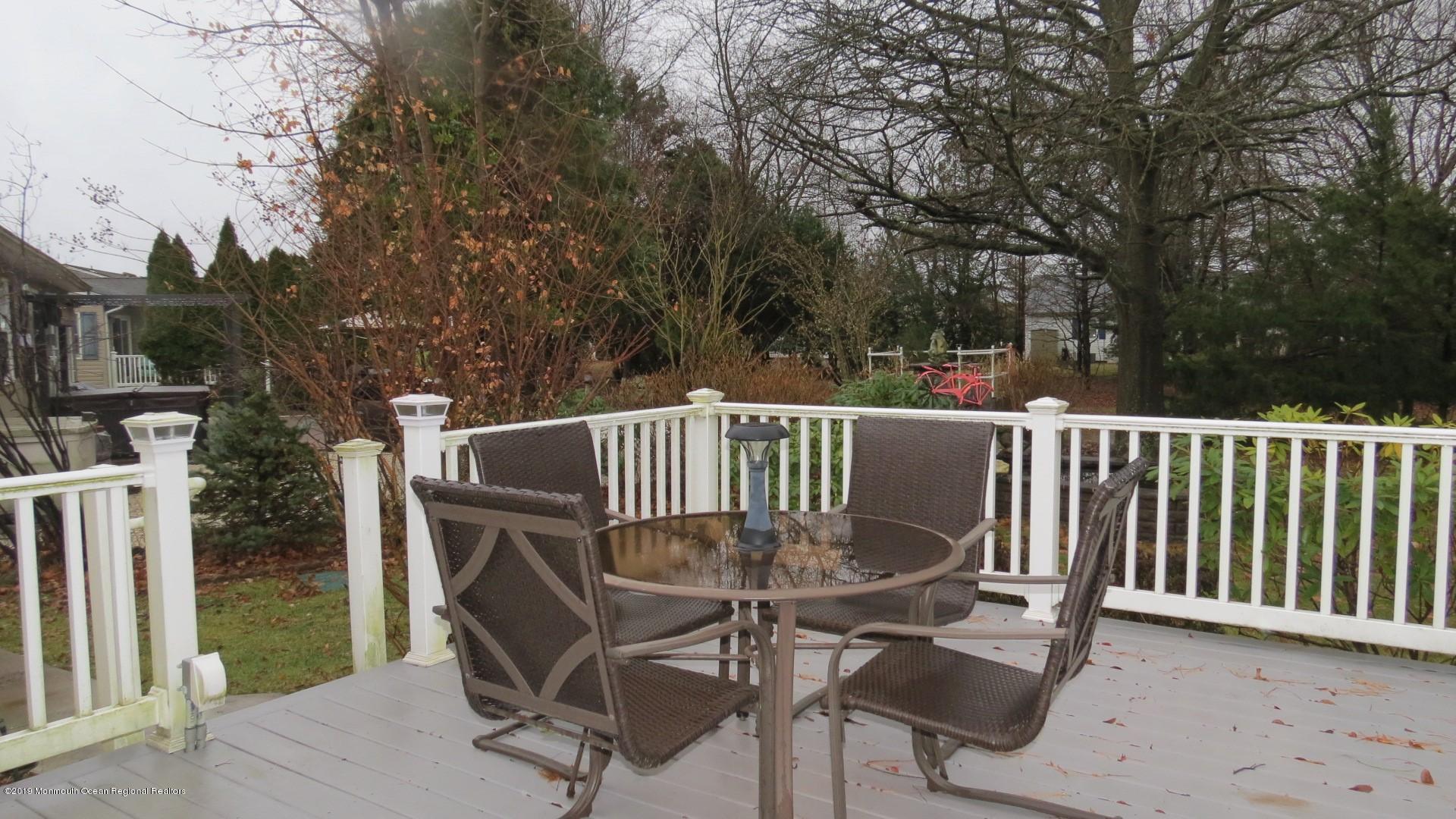 24 Coventry Road Toms River, NJ 08757 - Photo 19 of 21 a view of a chair and table on the wooden floor
