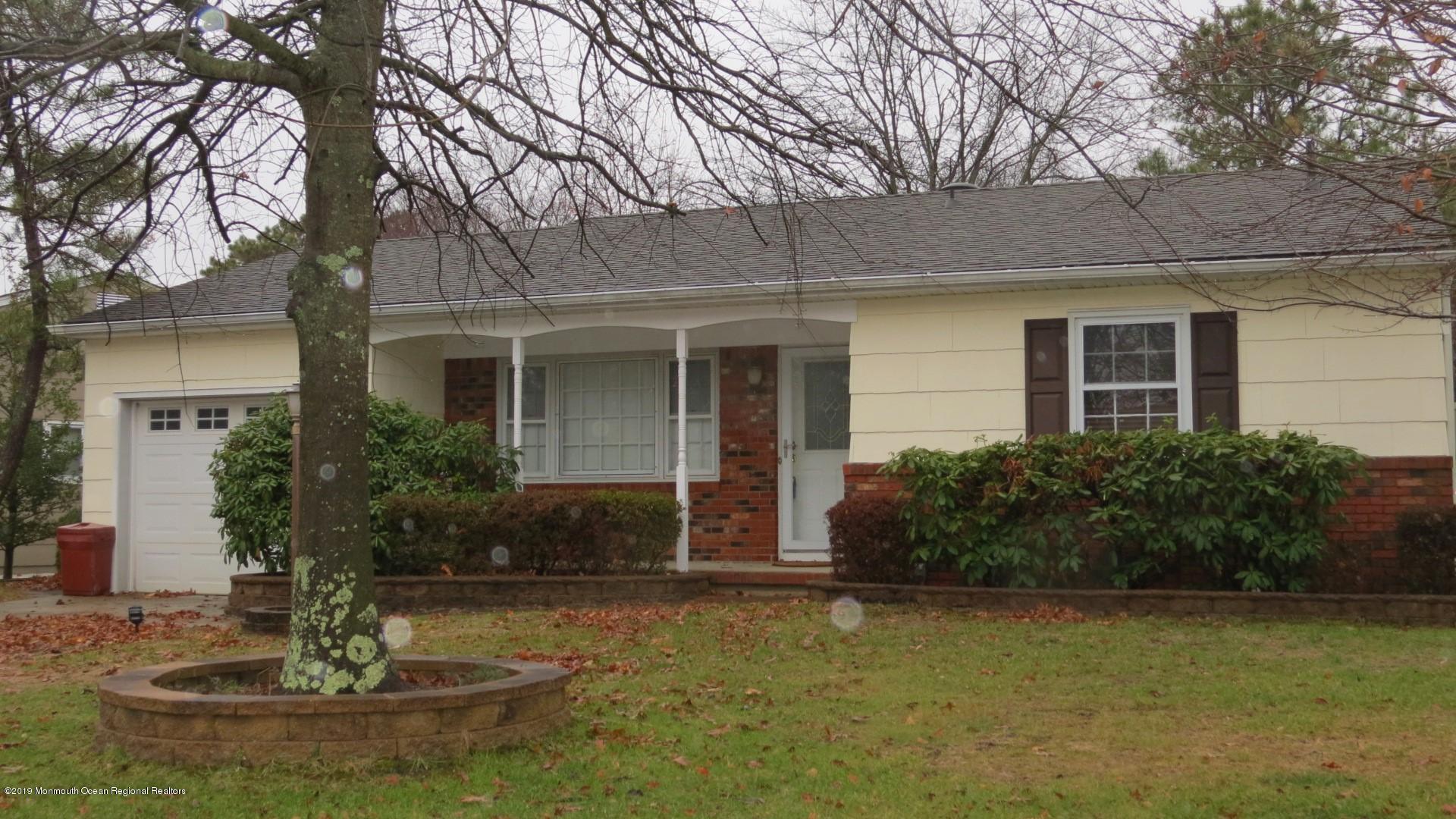 24 Coventry Road Toms River, NJ 08757 - Photo 2 of 21 a front view of a house with garden
