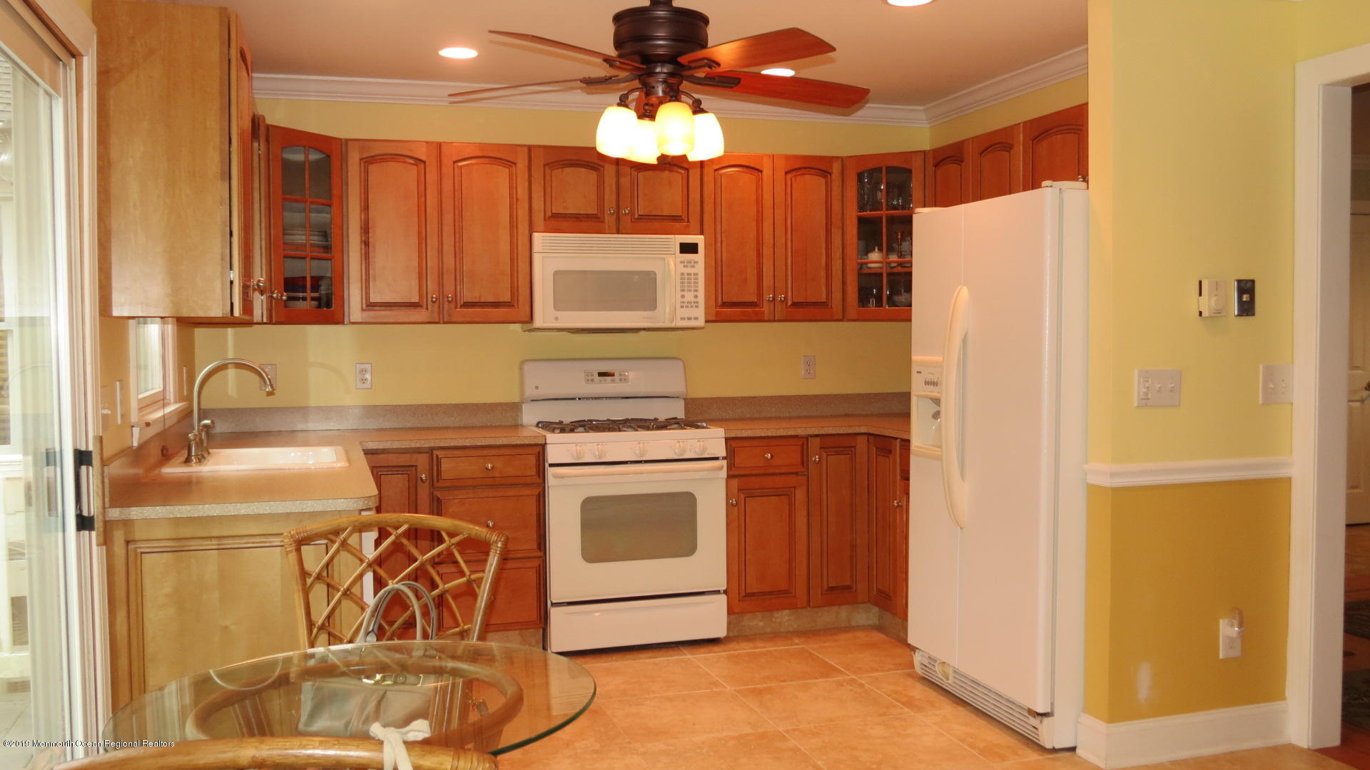 24 Coventry Road Toms River, NJ 08757 - Photo 7 of 21 a kitchen with a stove and a refrigerator