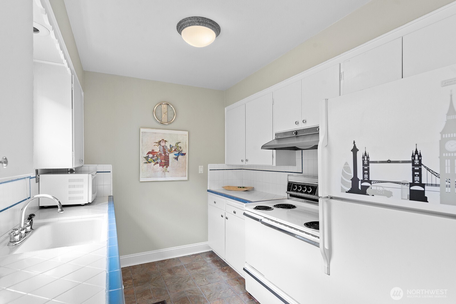 116 Williams Avenue South Renton, WA 98057 - Photo 16 of 37 a kitchen with stainless steel appliances granite countertop a sink and a stove