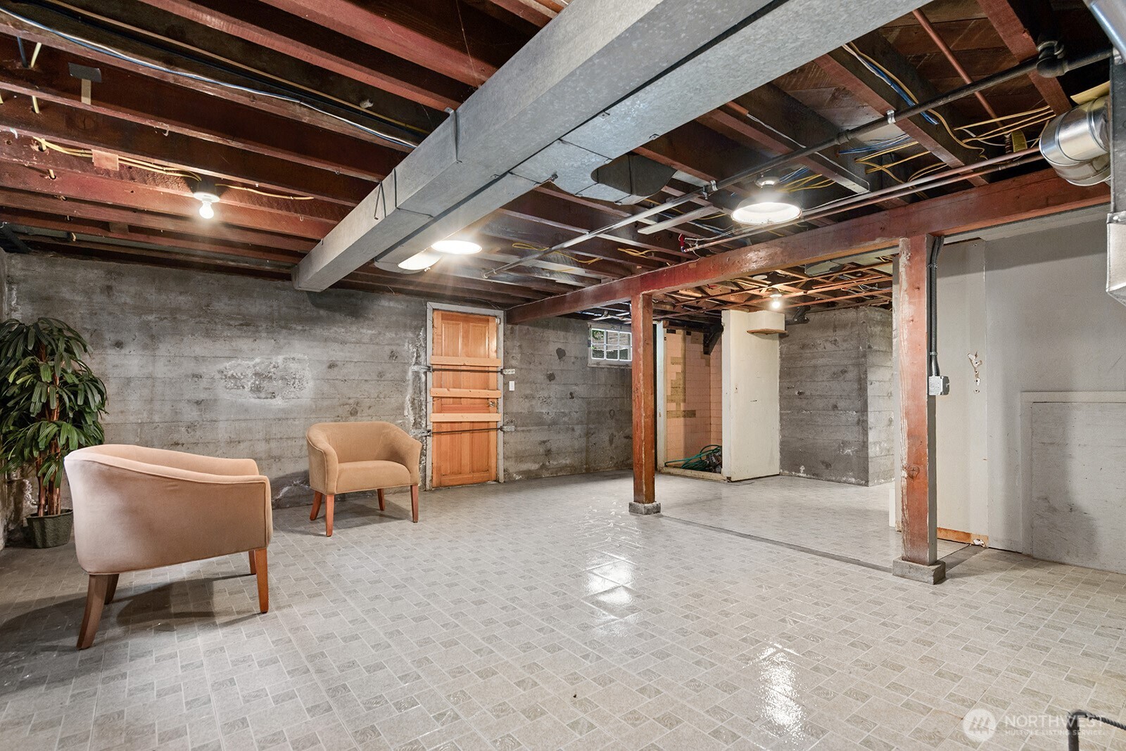 116 Williams Avenue South Renton, WA 98057 - Photo 20 of 37 a view of an empty room with chair and a ceiling fan