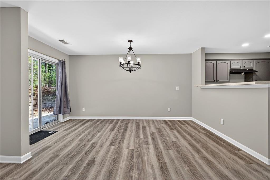 1065 Maple Valley Court Union City, GA 30291 - Photo 11 of 29 a view of empty room with wooden floor and fan