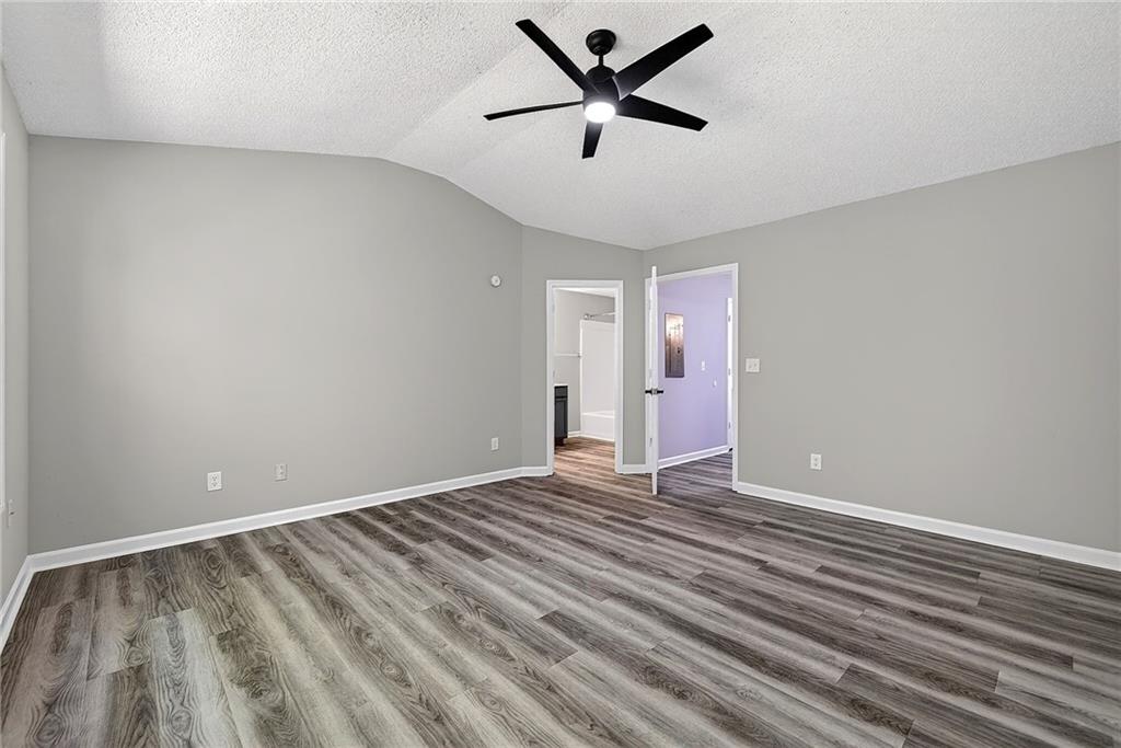 1065 Maple Valley Court Union City, GA 30291 - Photo 17 of 29 an empty room with a ceiling fan and window