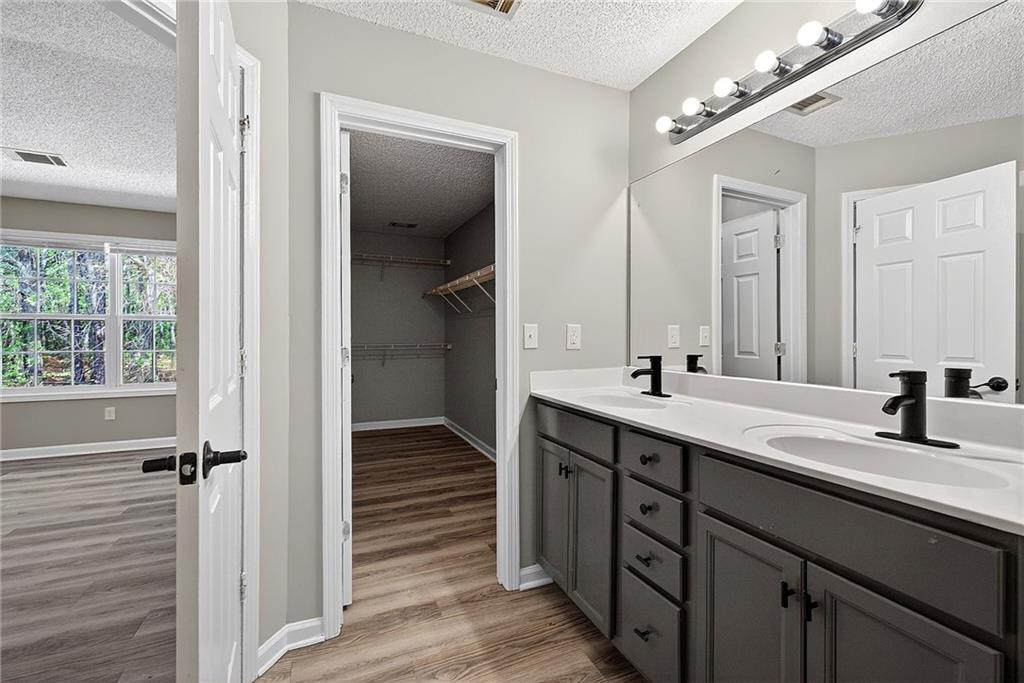1065 Maple Valley Court Union City, GA 30291 - Photo 20 of 29 a bathroom with a double vanity sink and a mirror