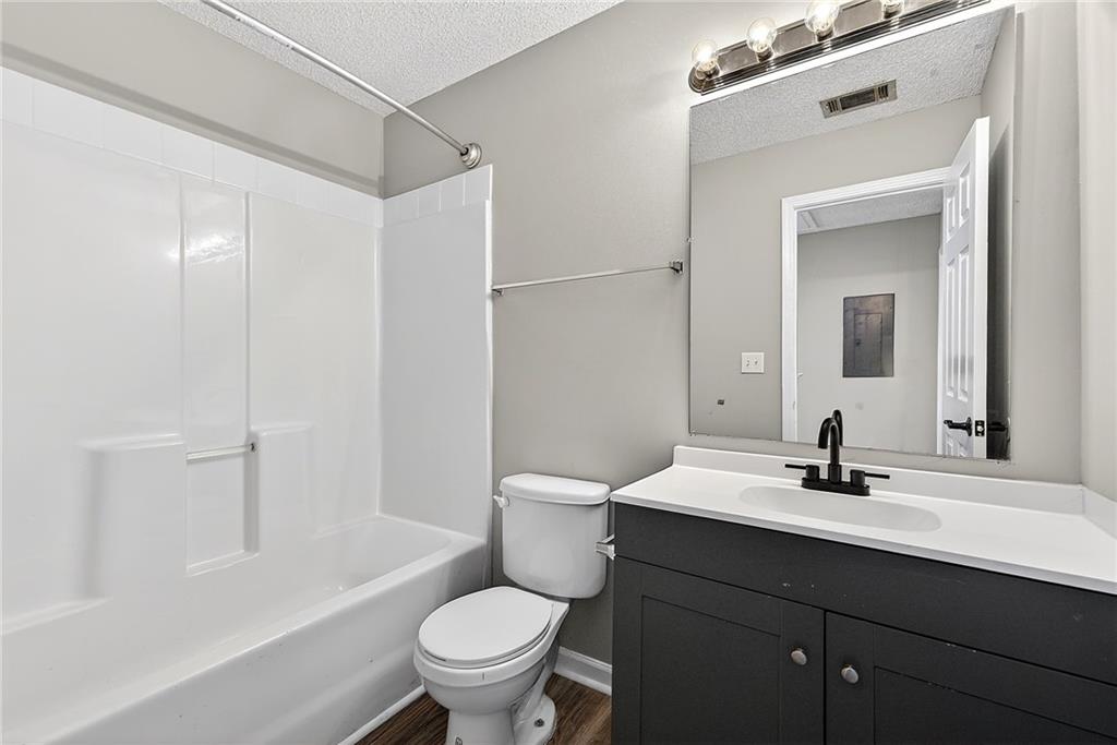 1065 Maple Valley Court Union City, GA 30291 - Photo 25 of 29 a bathroom with a sink toilet and shower