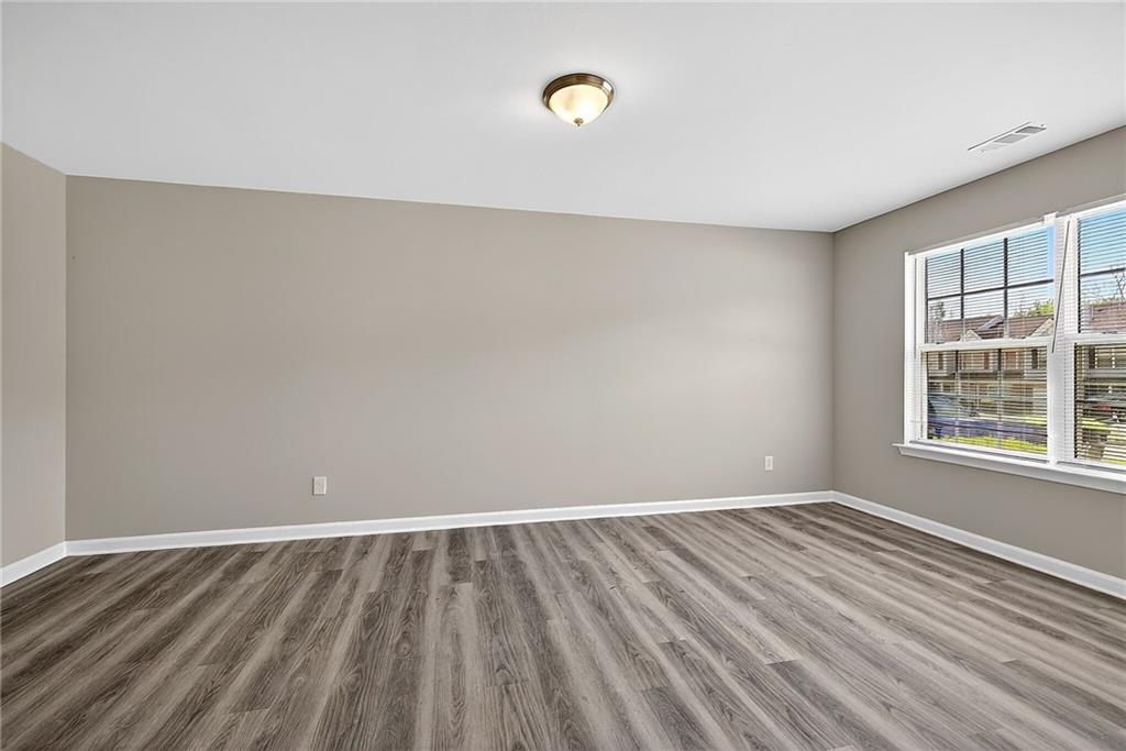 1065 Maple Valley Court Union City, GA 30291 - Photo 5 of 29 a view of room with window and hardwood floor