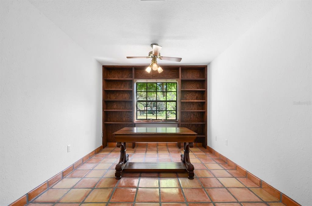 3636 Lake Buynak Road Windermere, FL 34786 - Photo 16 of 32 a bench sitting in a room next to a window