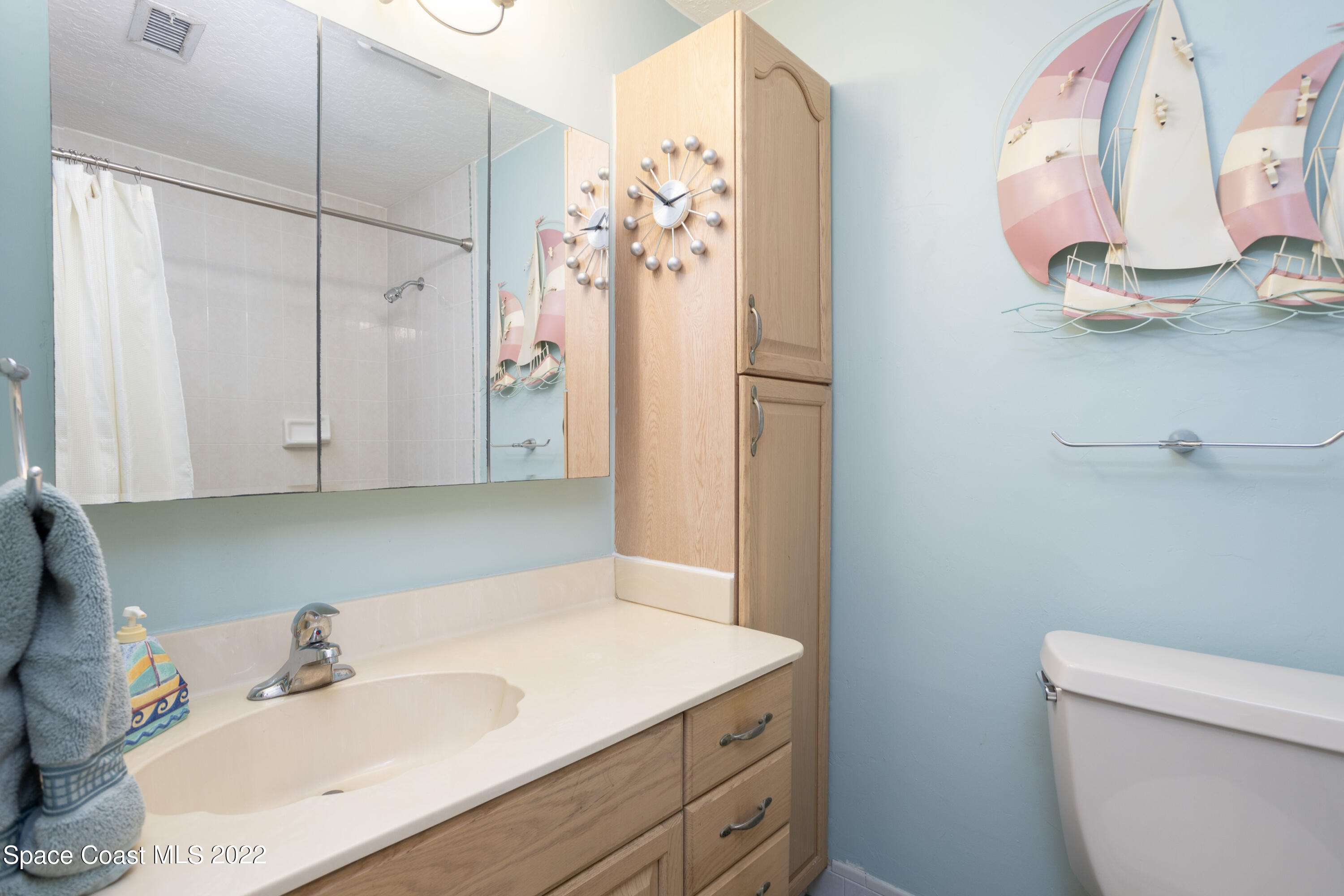947 Brunswick Lane Rockledge, FL 32955 - Photo 17 of 22 a bathroom with a sink vanity granite and toilet