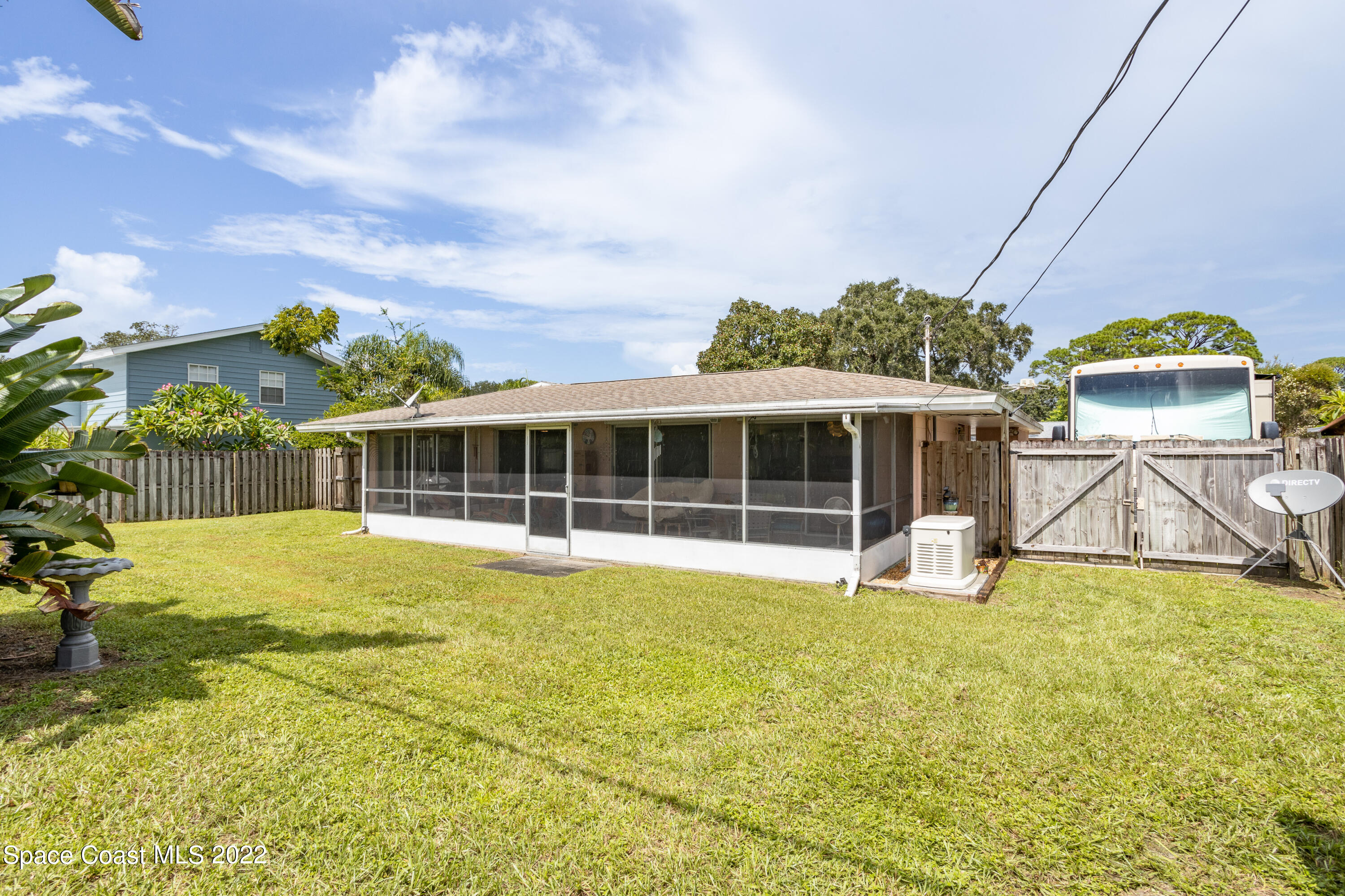 947 Brunswick Lane Rockledge, FL 32955 - Photo 21 of 22 a view of a house with pool and a yard