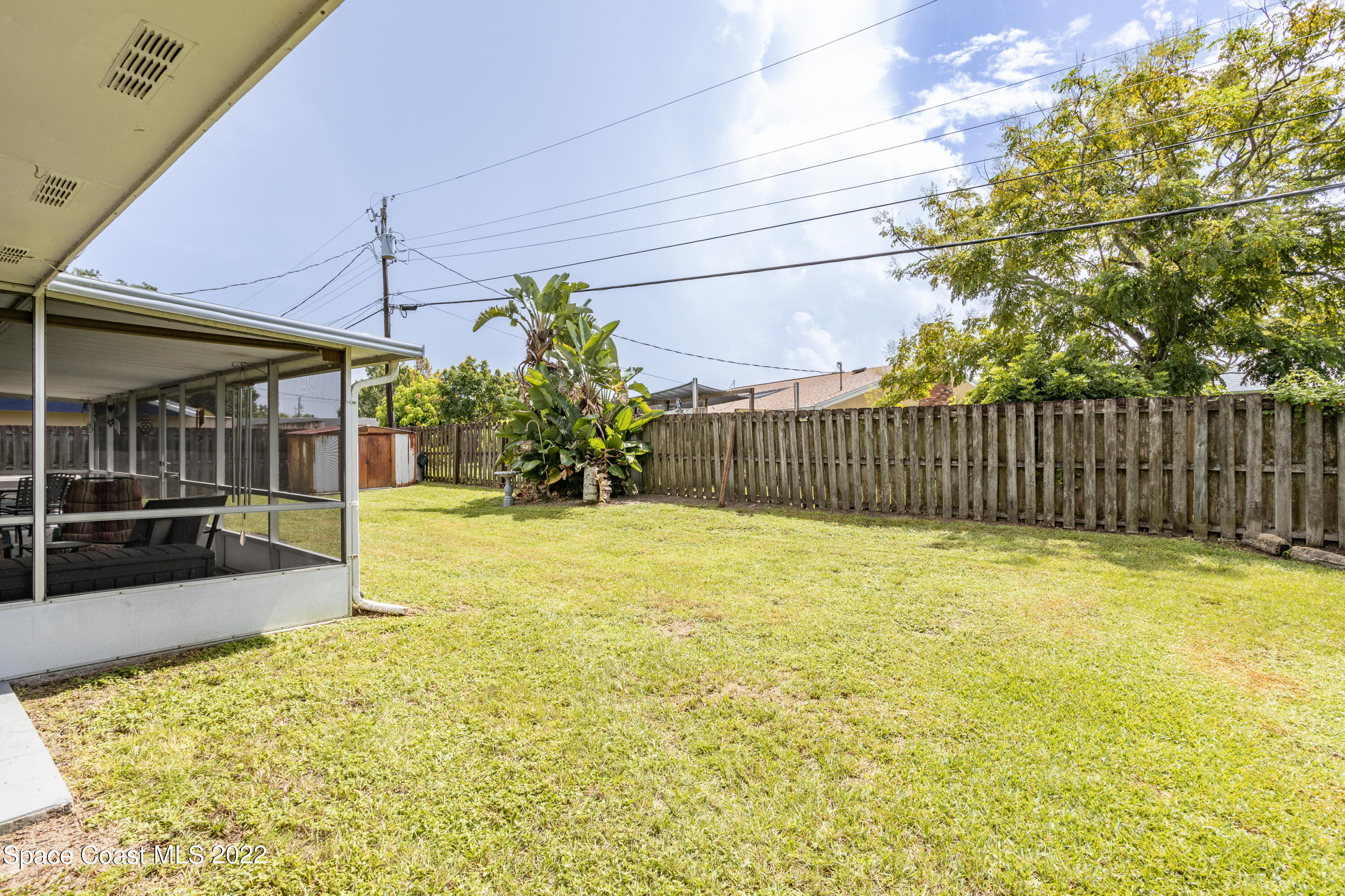 947 Brunswick Lane Rockledge, FL 32955 - Photo 22 of 22 a view of a backyard with garden