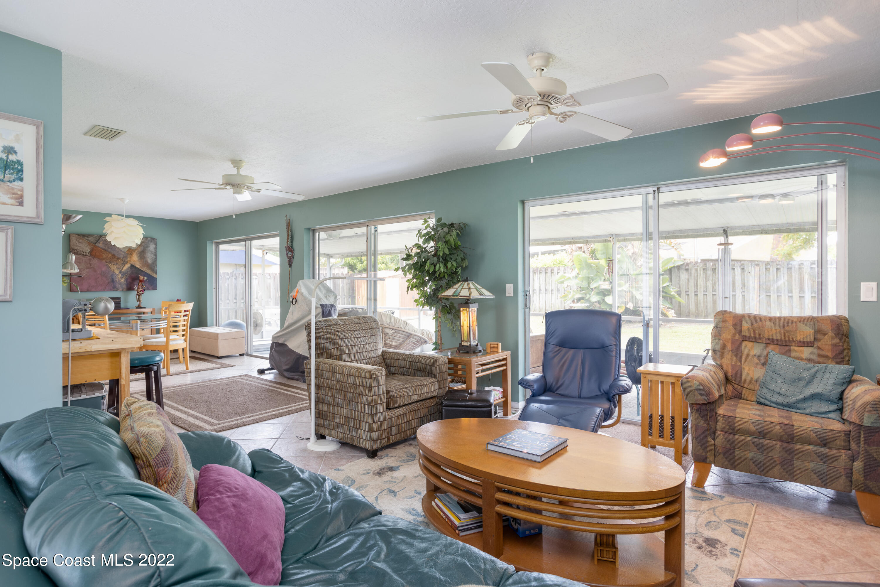947 Brunswick Lane Rockledge, FL 32955 - Photo 6 of 22 a living room with furniture and a large window