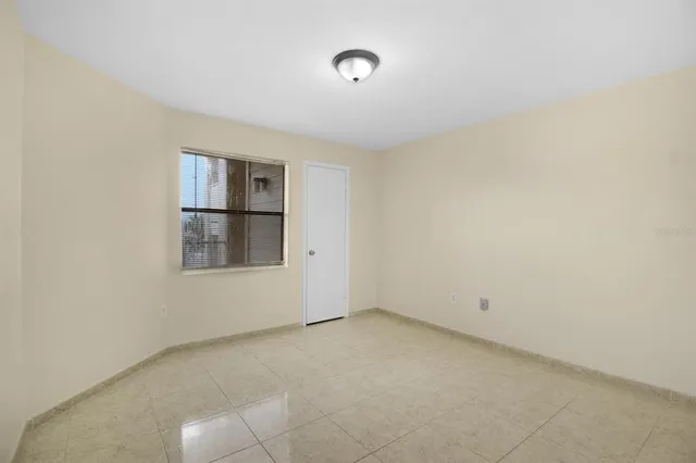 a kitchen with granite countertop a sink stove and refrigerator