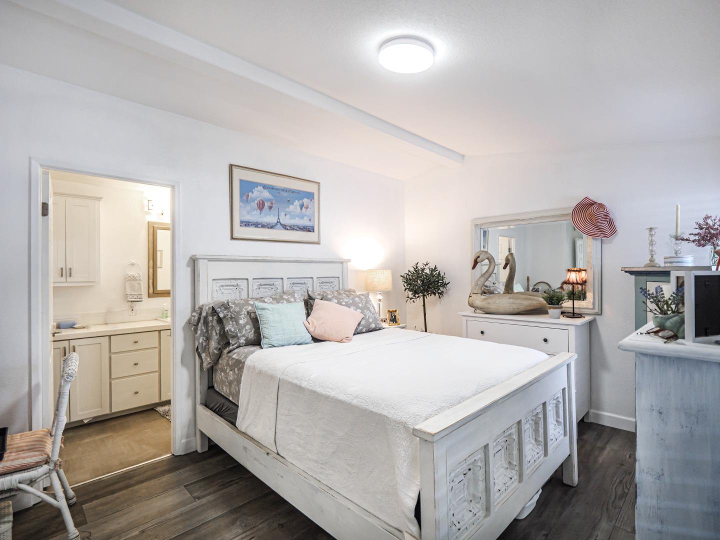 100 North Rodeo Gulch Road, Unit 65 Soquel, CA 95073 - Photo 14 of 24 a bedroom with a bed and a cabinets