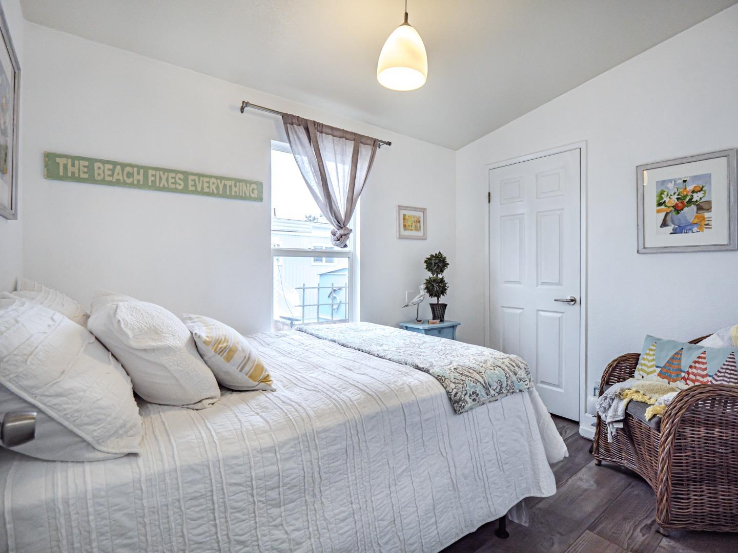 100 North Rodeo Gulch Road, Unit 65 Soquel, CA 95073 - Photo 17 of 24 a bedroom with a bed and a window