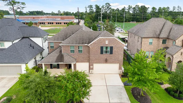 a aerial view of a house with a garden and plants