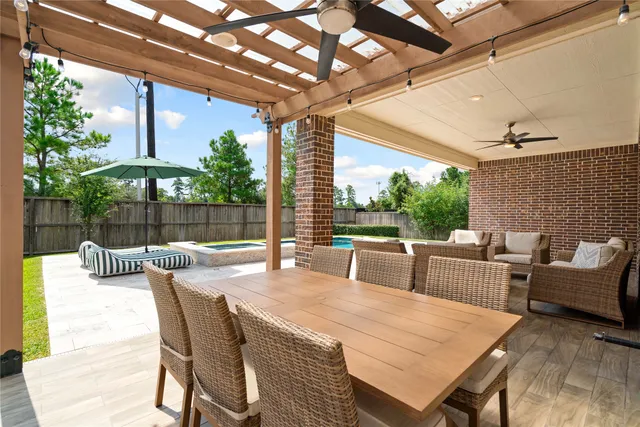 a view of an outside dining space with furniture