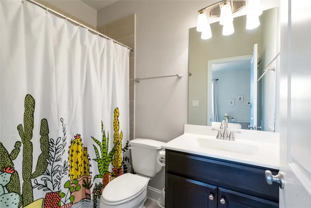 a bathroom with a sink a mirror and a toilet