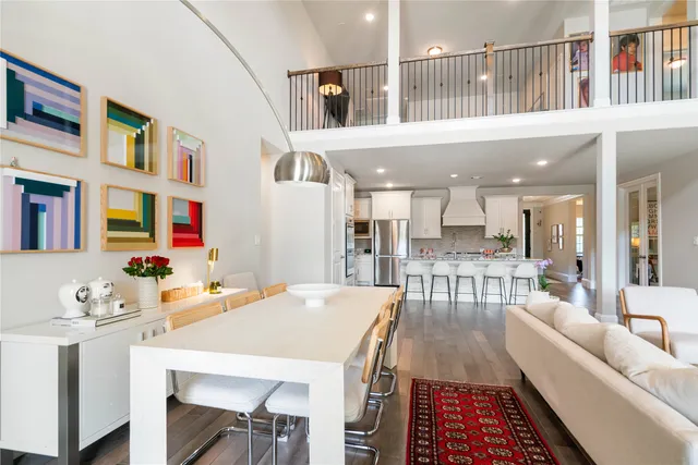 a view of a dining room with furniture and a rug