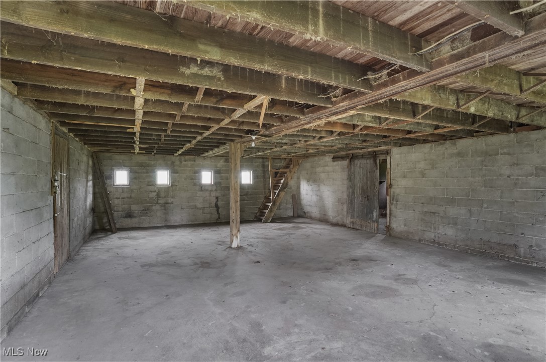 12395 Carter Road Painesville, OH 44077 - Photo 12 of 39 Unfinished basement featuring concrete block wall