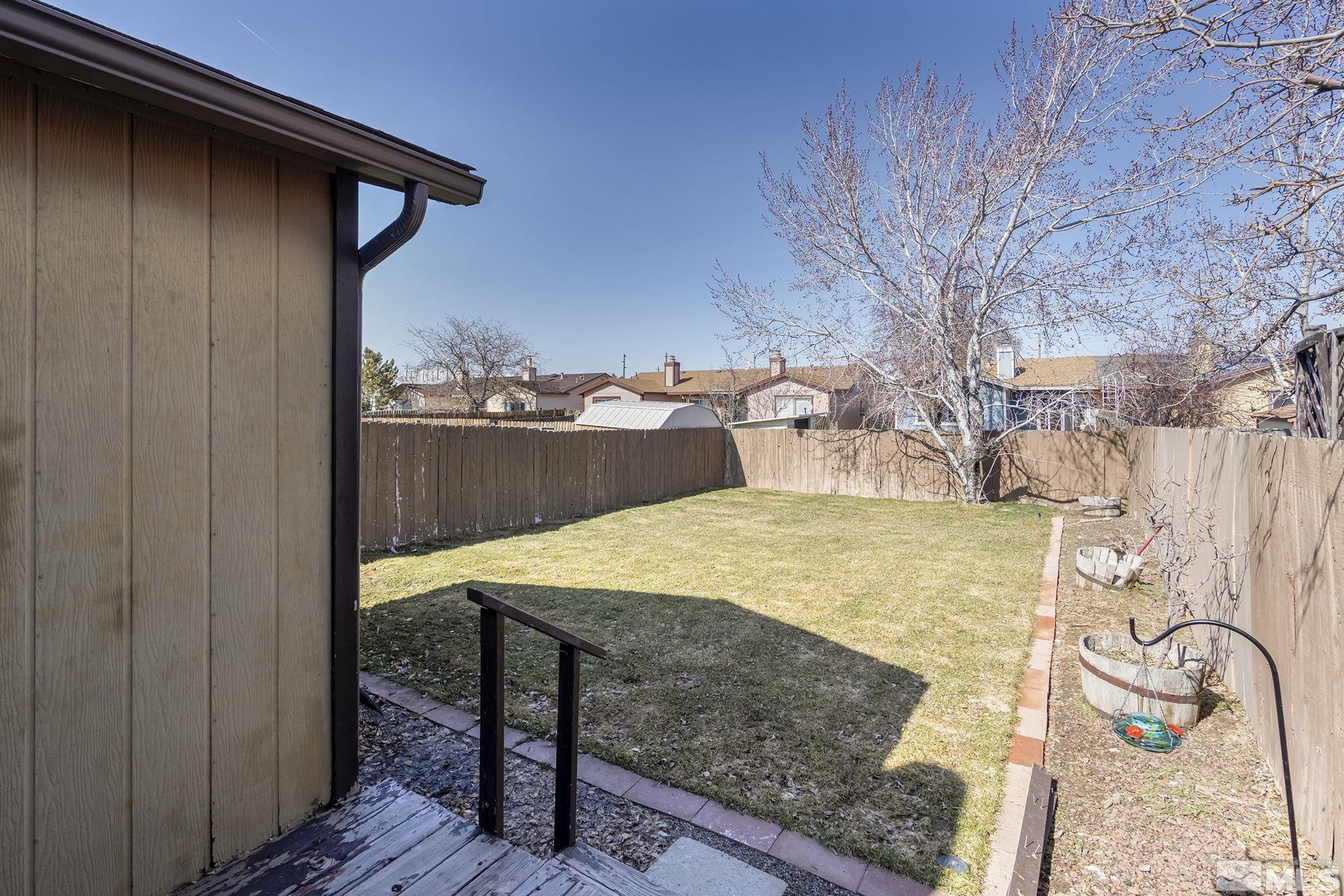 10029 Humite Lane Reno, NV 89506 - Photo 13 of 15 a view of a backyard with wooden floor