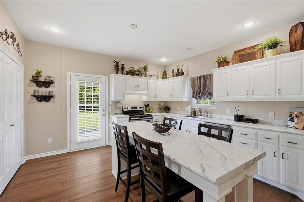 15656 South State Highway 78 Blue Ridge, TX 75424 - Photo 15 of 36 a view of kitchen with cabinets table and chairs