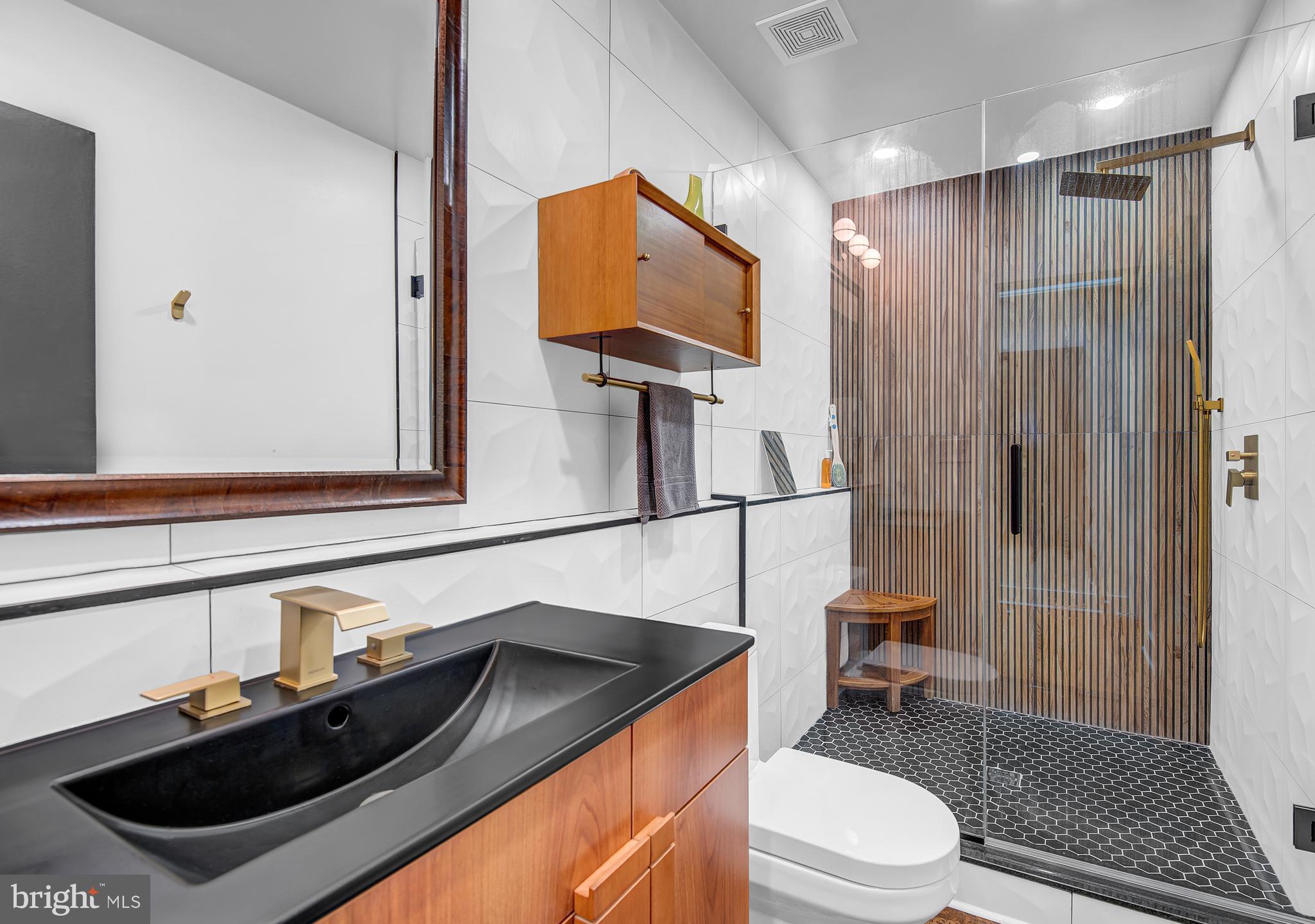 1410 Mason Street Baltimore, MD 21217 - Photo 20 of 24 a bathroom with a sink a toilet and shower