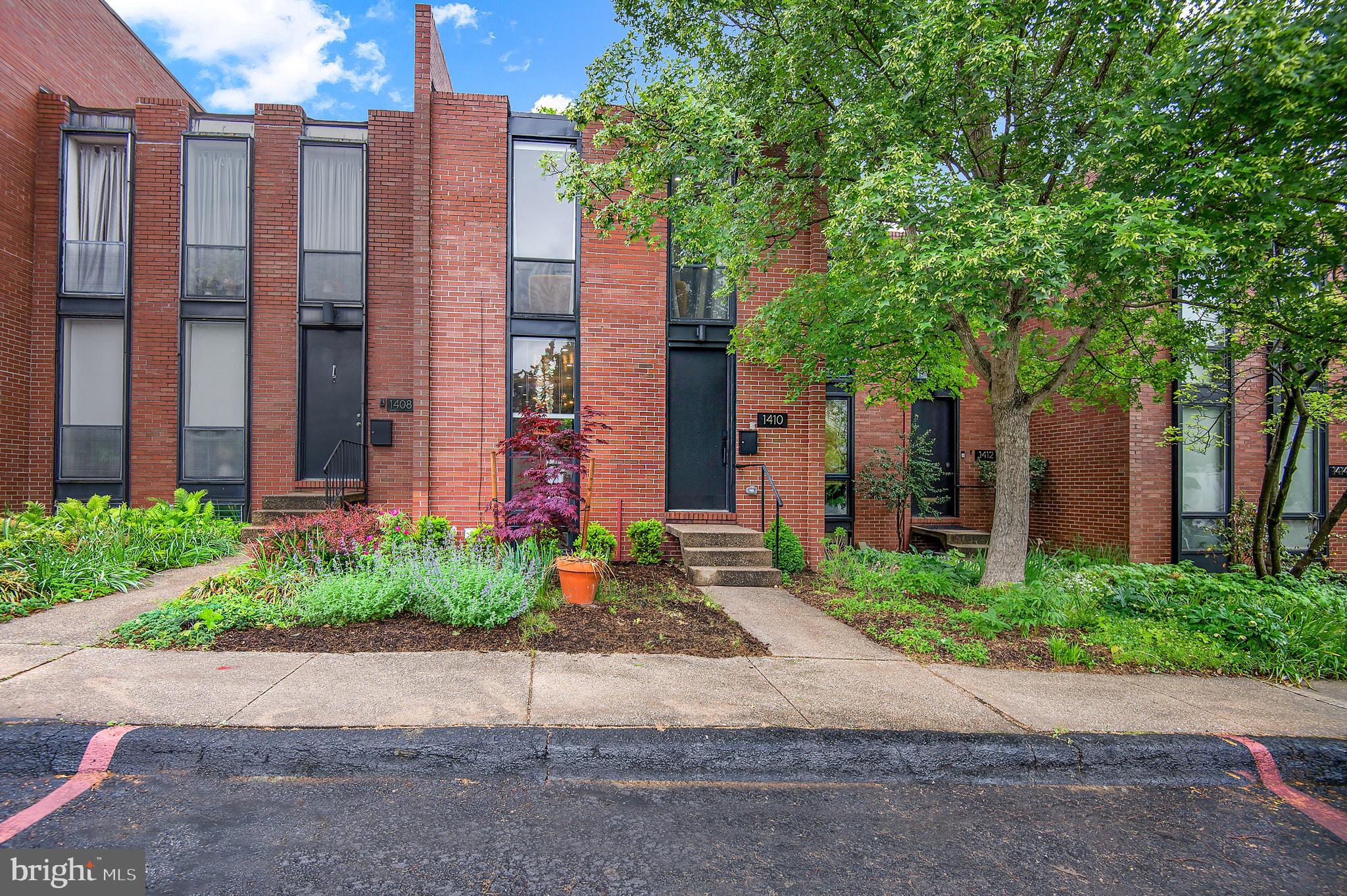 1410 Mason Street Baltimore, MD 21217 - Photo 3 of 24 a front view of a building with garden