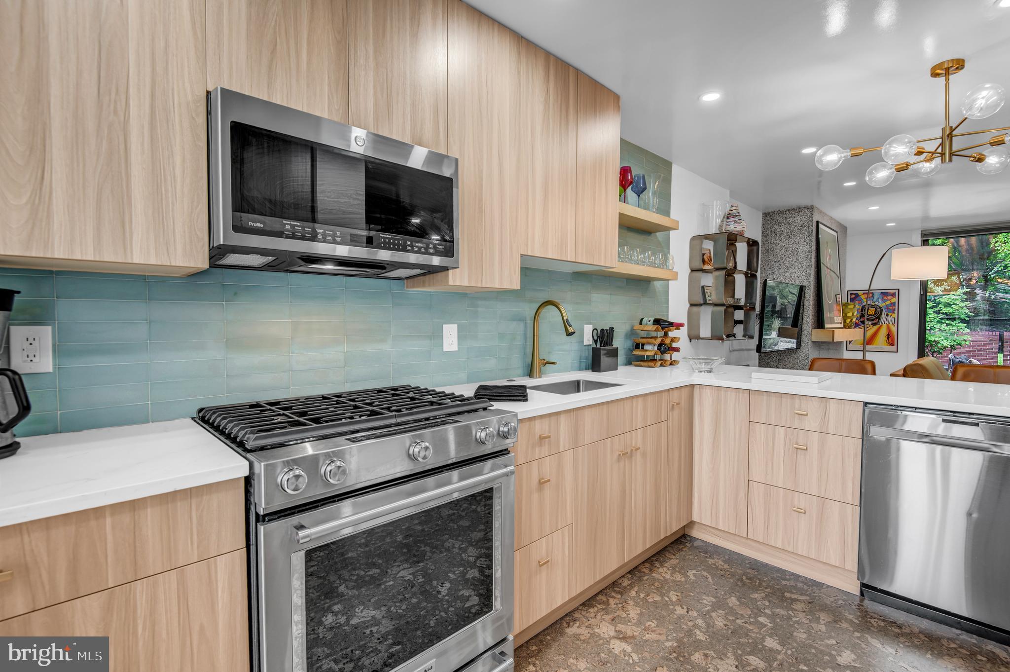 1410 Mason Street Baltimore, MD 21217 - Photo 7 of 24 a kitchen with stainless steel appliances granite countertop a sink dishwasher a stove and a microwave oven with cabinets