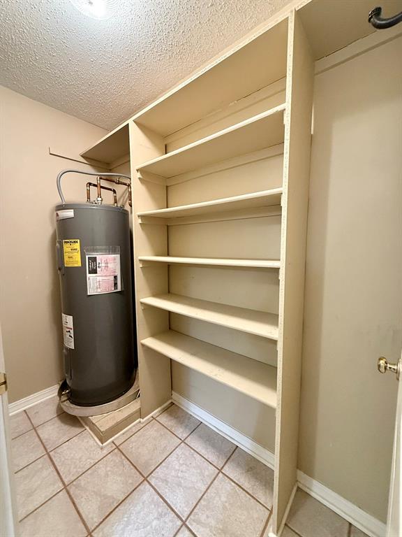 11535 Timber Ridge Drive Keithville, LA 71047 - Photo 22 of 39 a view of walk in closet with empty racks