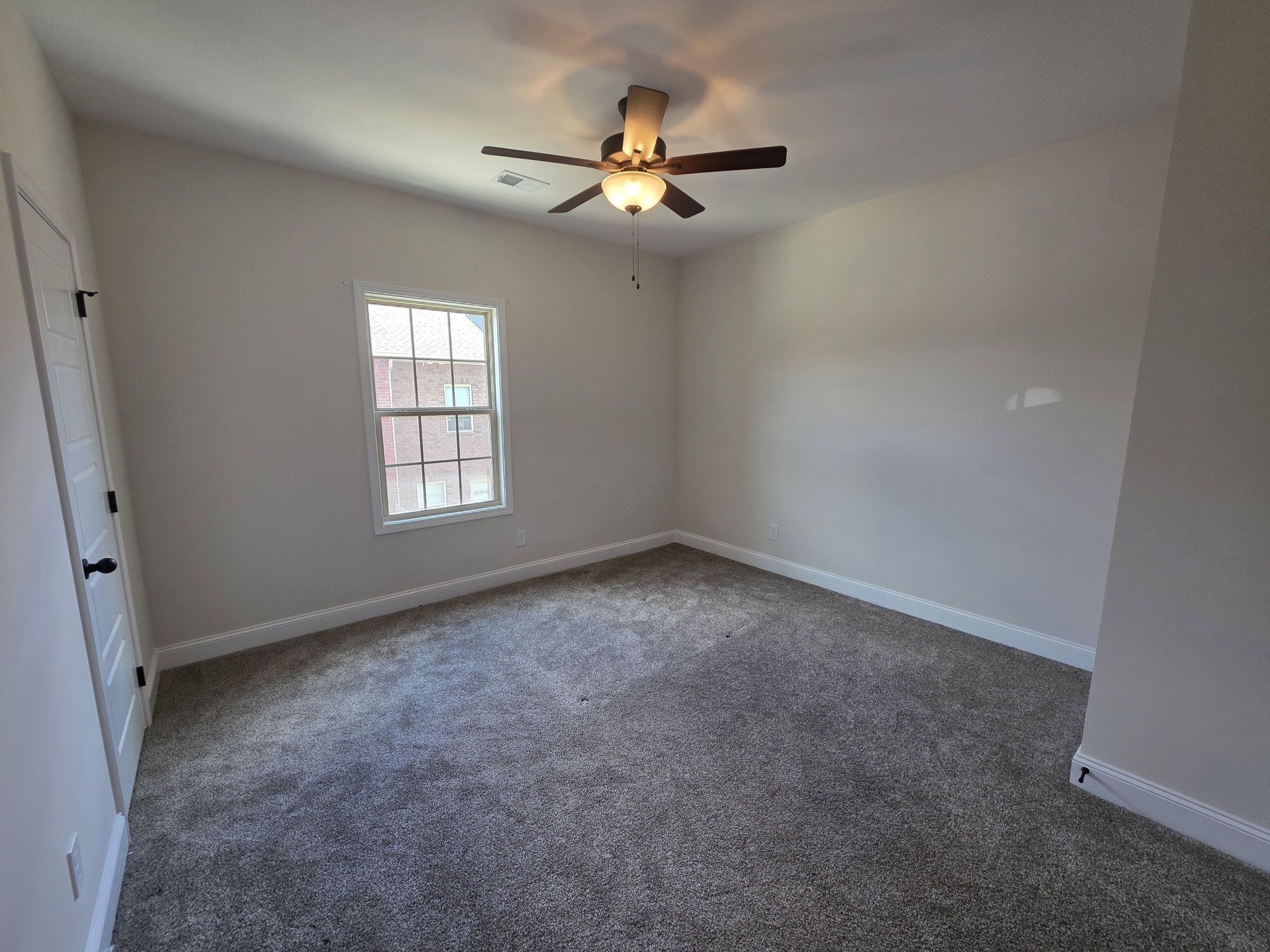 550 Peachers Mill Road, Unit E2 Clarksville, TN 37042 - Photo 6 of 11 an empty room with a window
