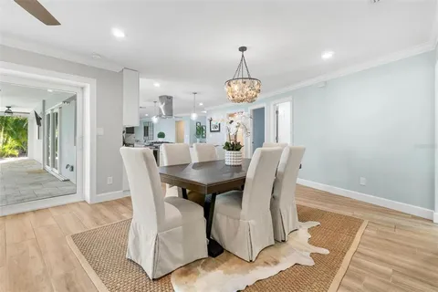 a view of a room with wooden floor and white walls
