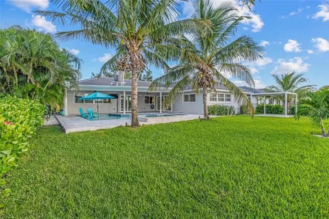 a patio with table and chairs