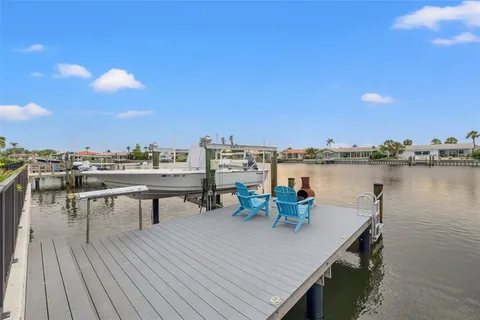 an aerial view of a house with a yard swimming pool outdoor seating and yard