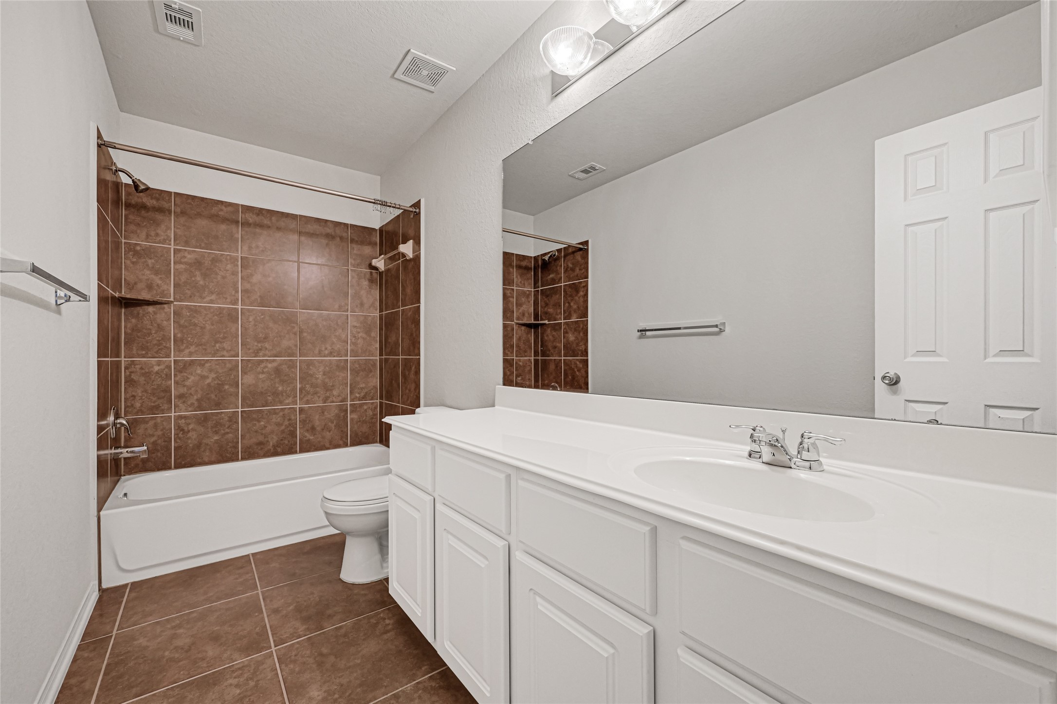 5331 Seabird Street Baytown, TX 77521 - Photo 34 of 38 a bathroom with a sink a toilet and shower