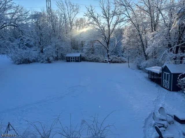 a view of a yard with an outdoor seating