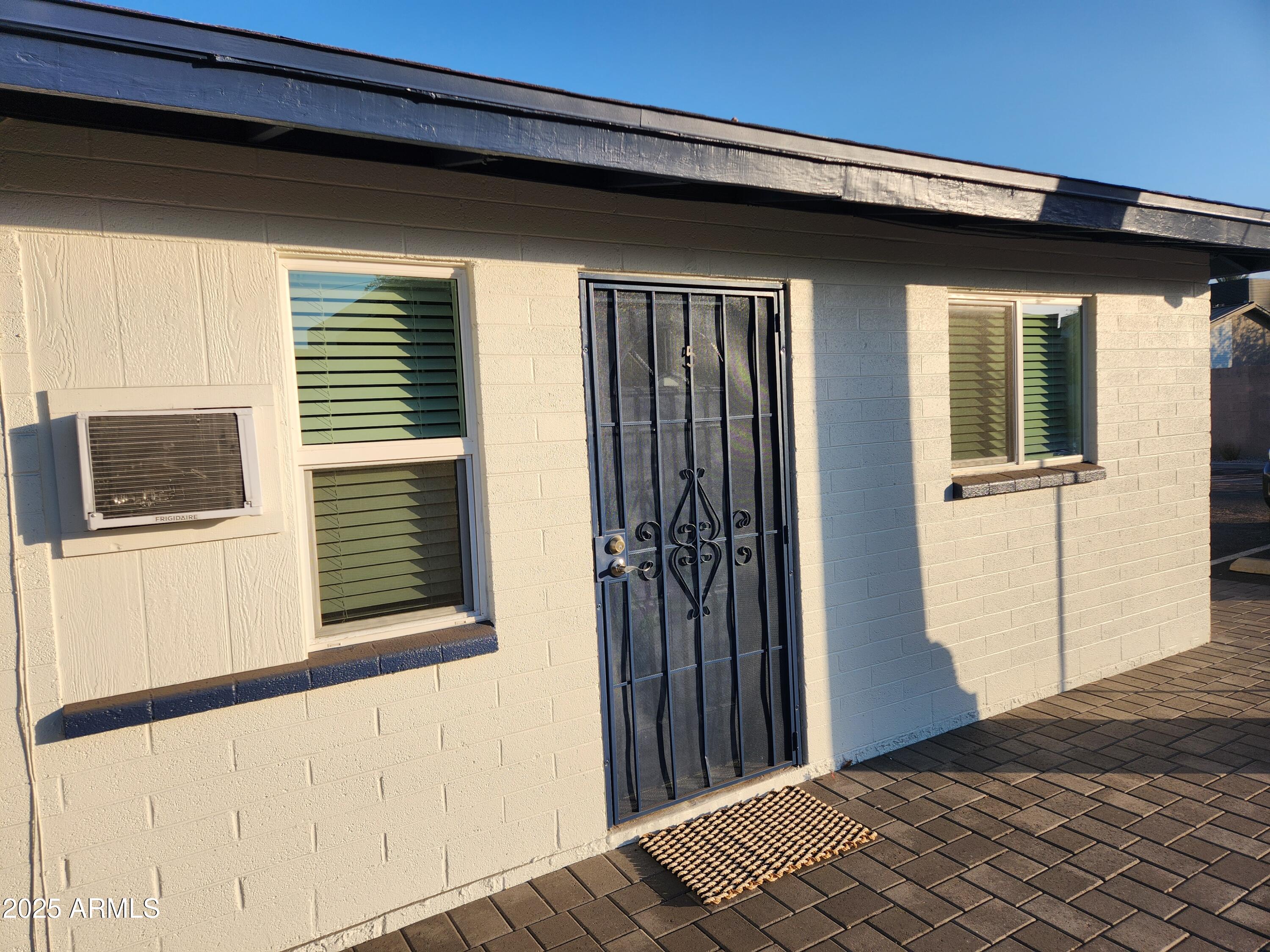 a view of a house with a wooden deck