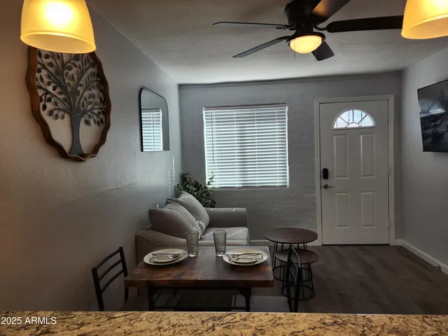 a living room with furniture and a table