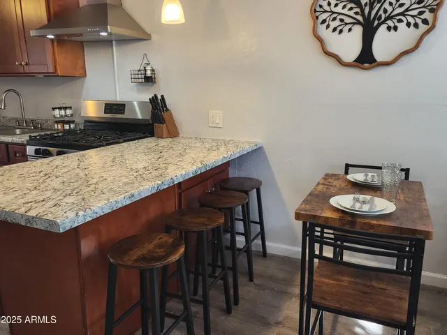 a kitchen with a table and chairs in it