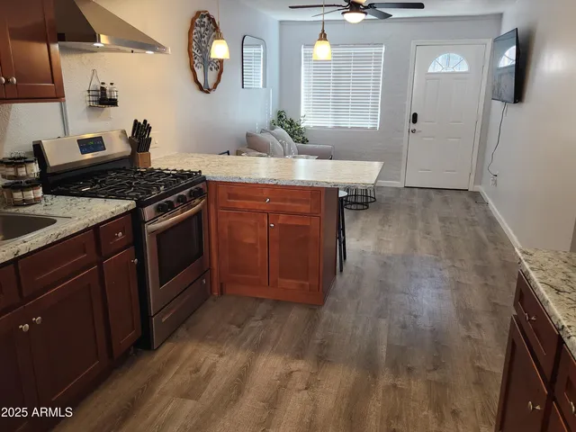 a kitchen with a stove and a sink